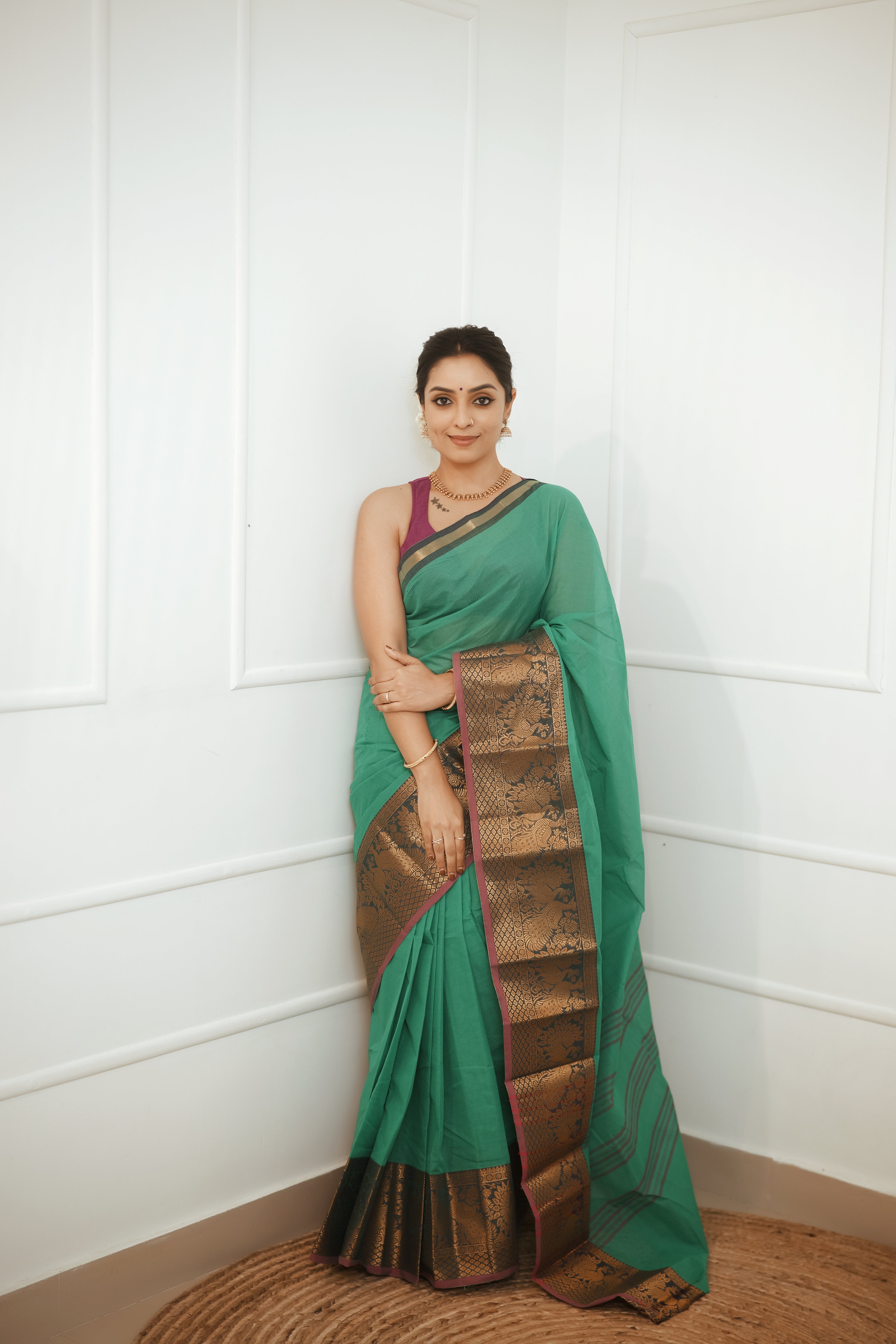 Nira – Emerald Green Cotton Saree with Antique Zari Border