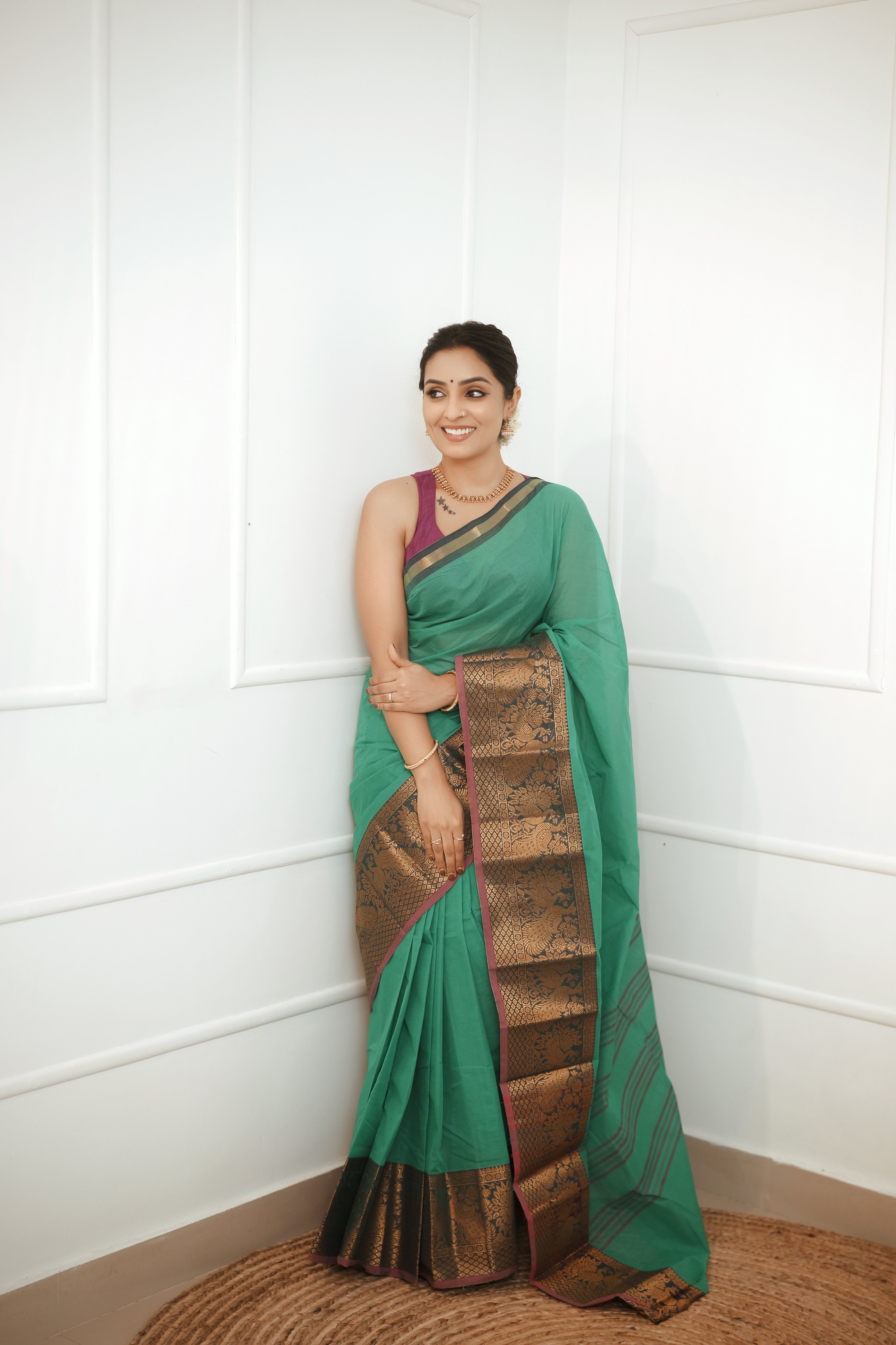 Nira – Emerald Green Cotton Saree with Antique Zari Border