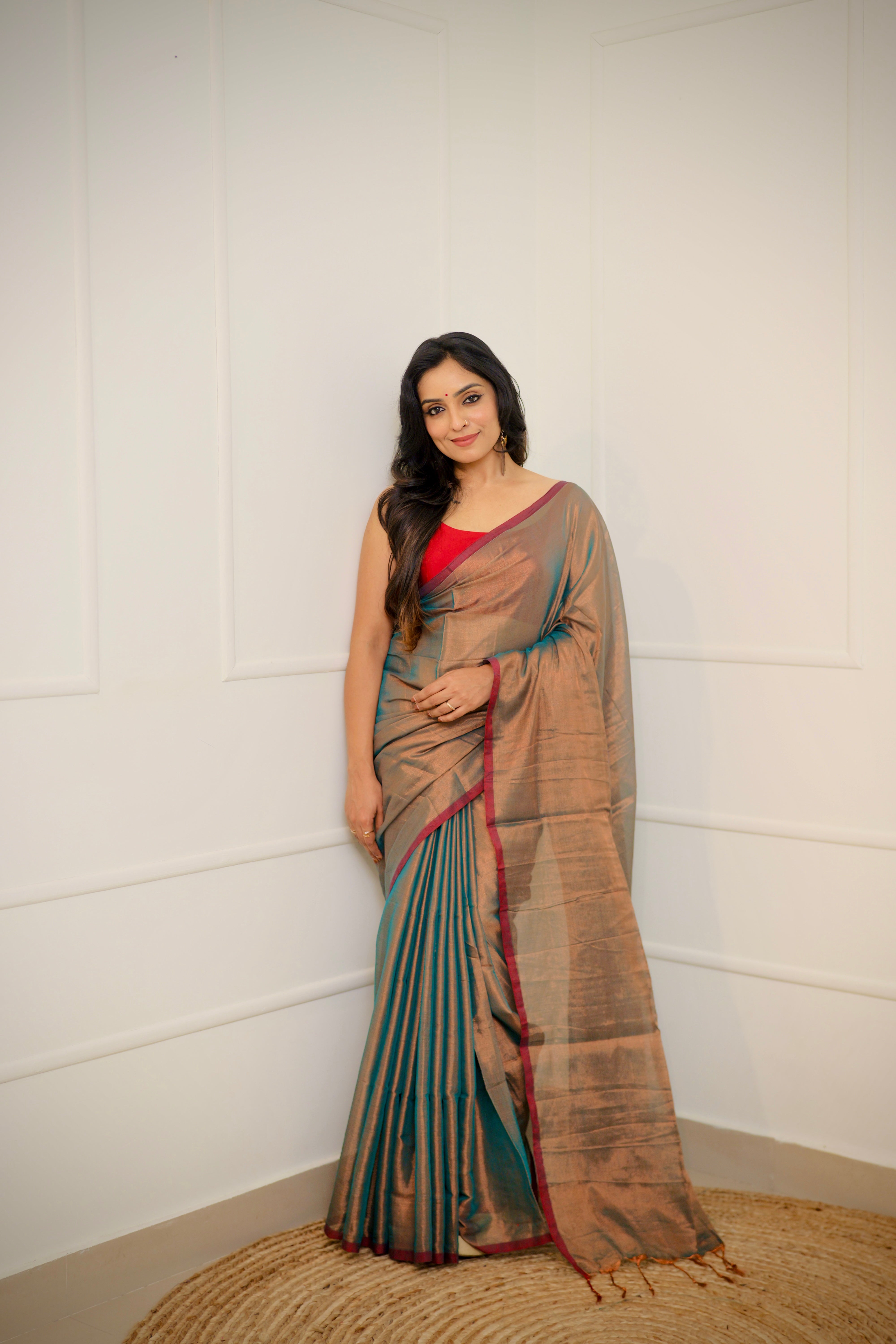 Tejal – Soft Bronze Tissue Saree with Teal Sheen & Wine Border