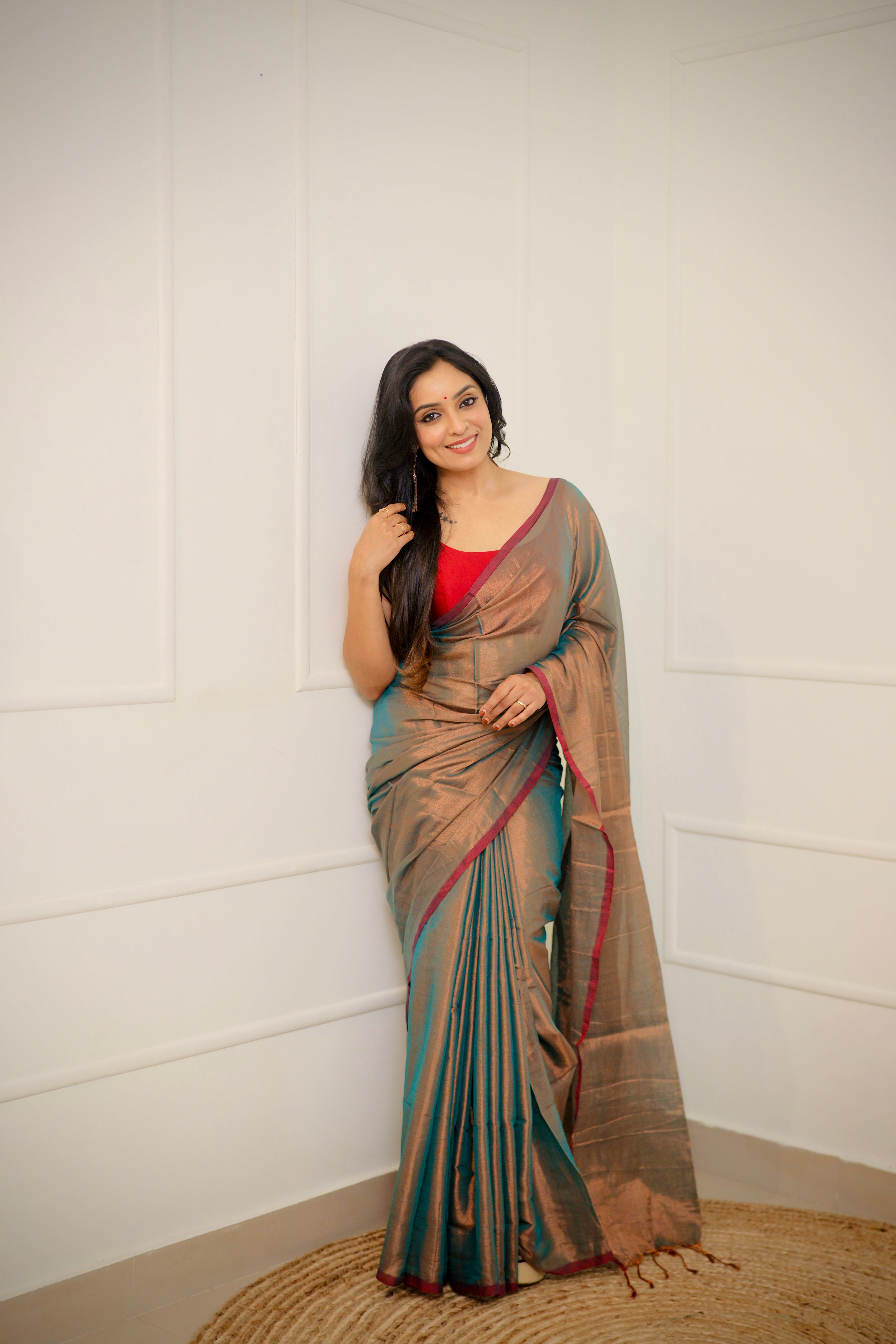 Tejal – Soft Bronze Tissue Saree with Teal Sheen & Wine Border
