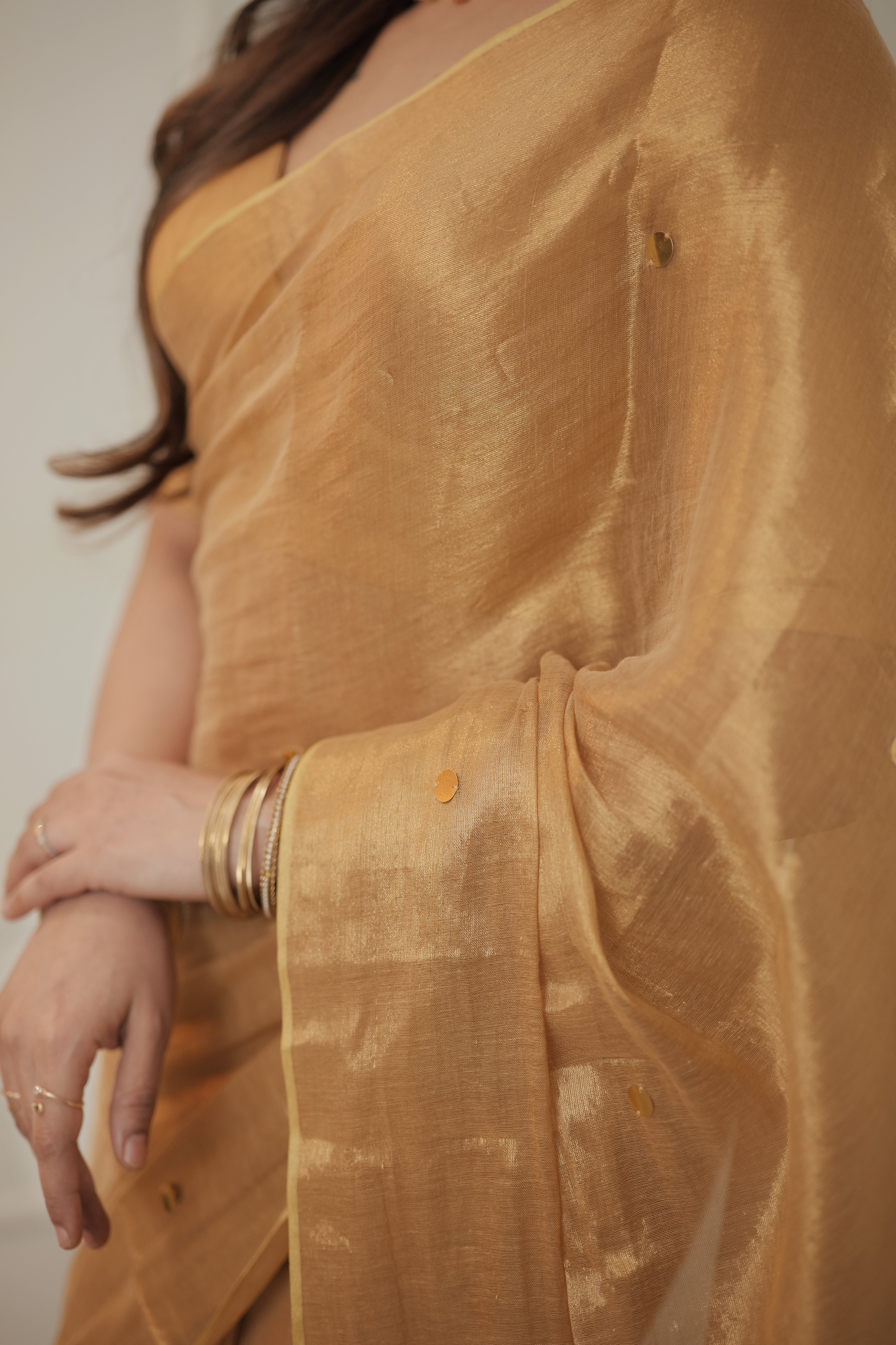 Naayika Suvarna – Golden Handloom Tissue Saree with Sequin Buttas