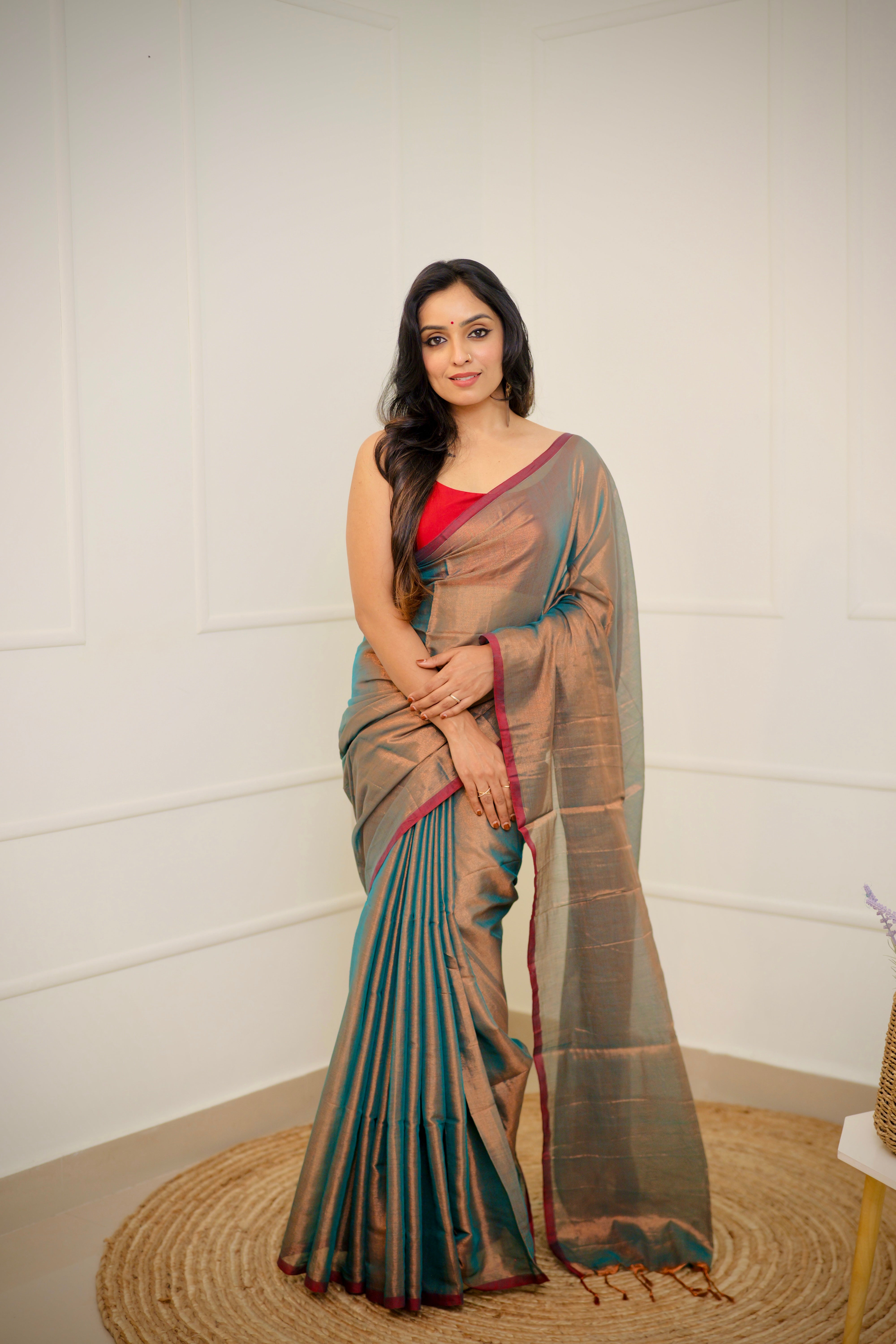 Tejal – Soft Bronze Tissue Saree with Teal Sheen & Wine Border