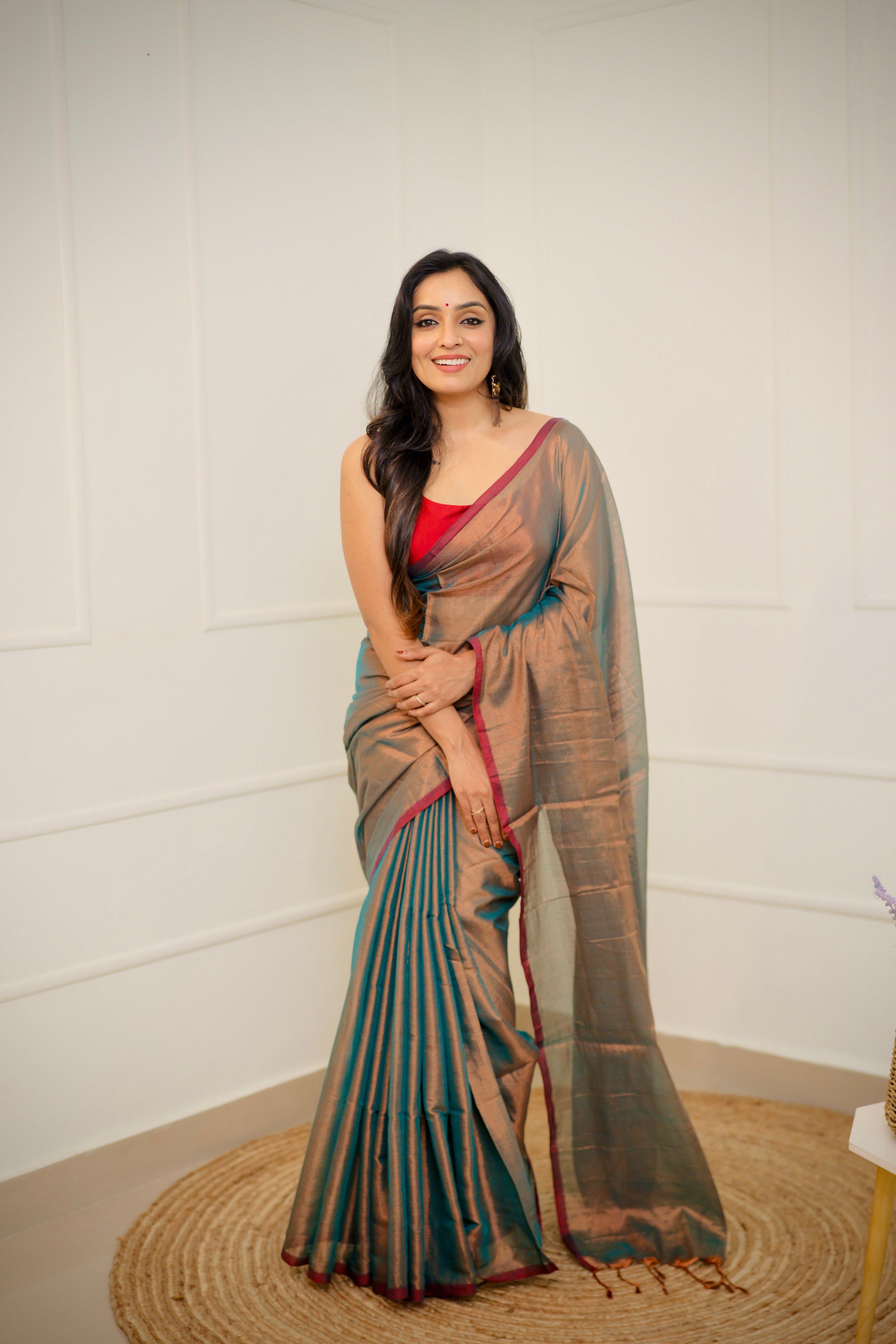 Tejal – Soft Bronze Tissue Saree with Teal Sheen & Wine Border