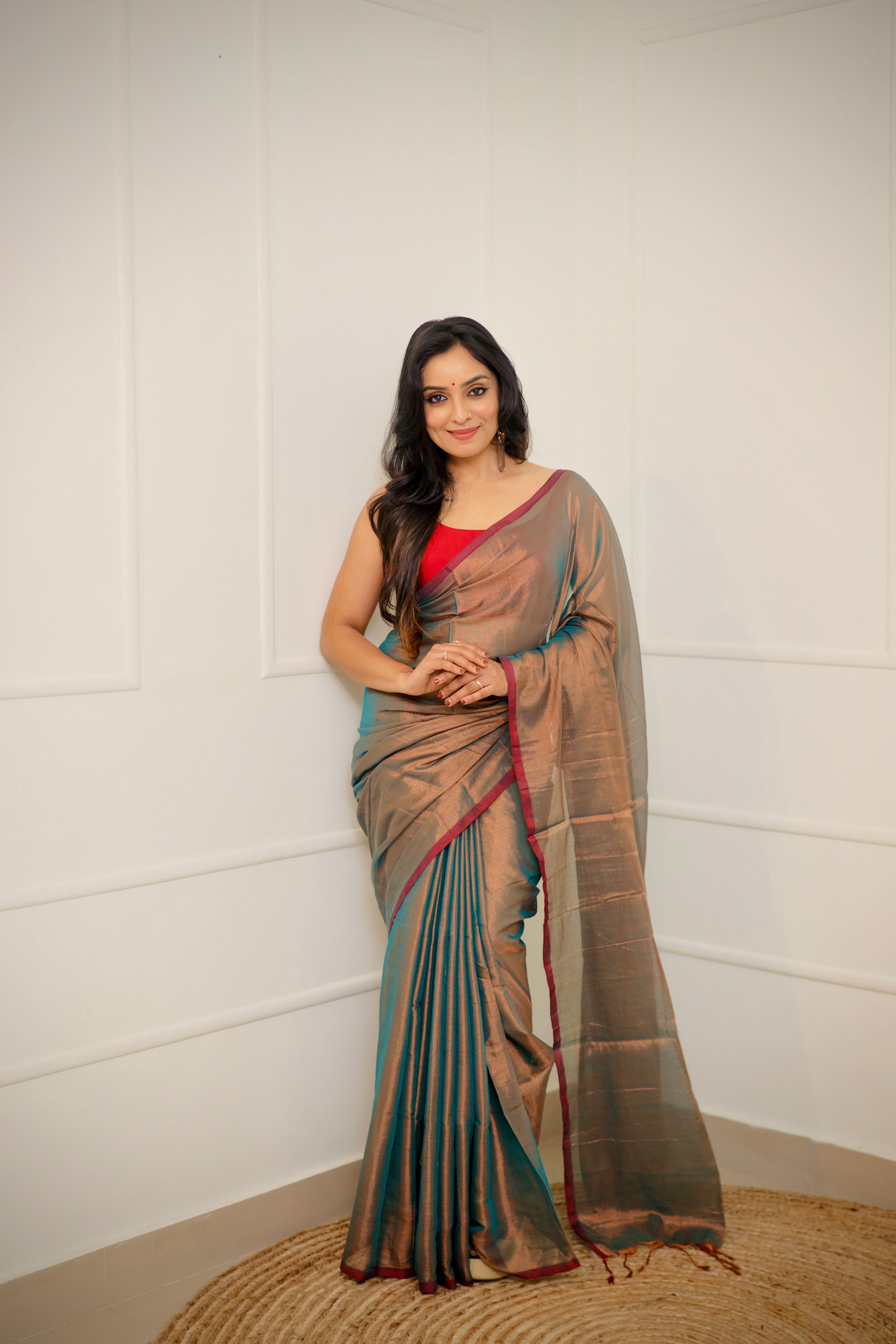 Tejal – Soft Bronze Tissue Saree with Teal Sheen & Wine Border